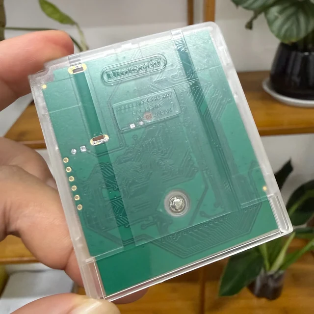 Original supplied product photograph: Transparent cartridge rear showing the circuit board