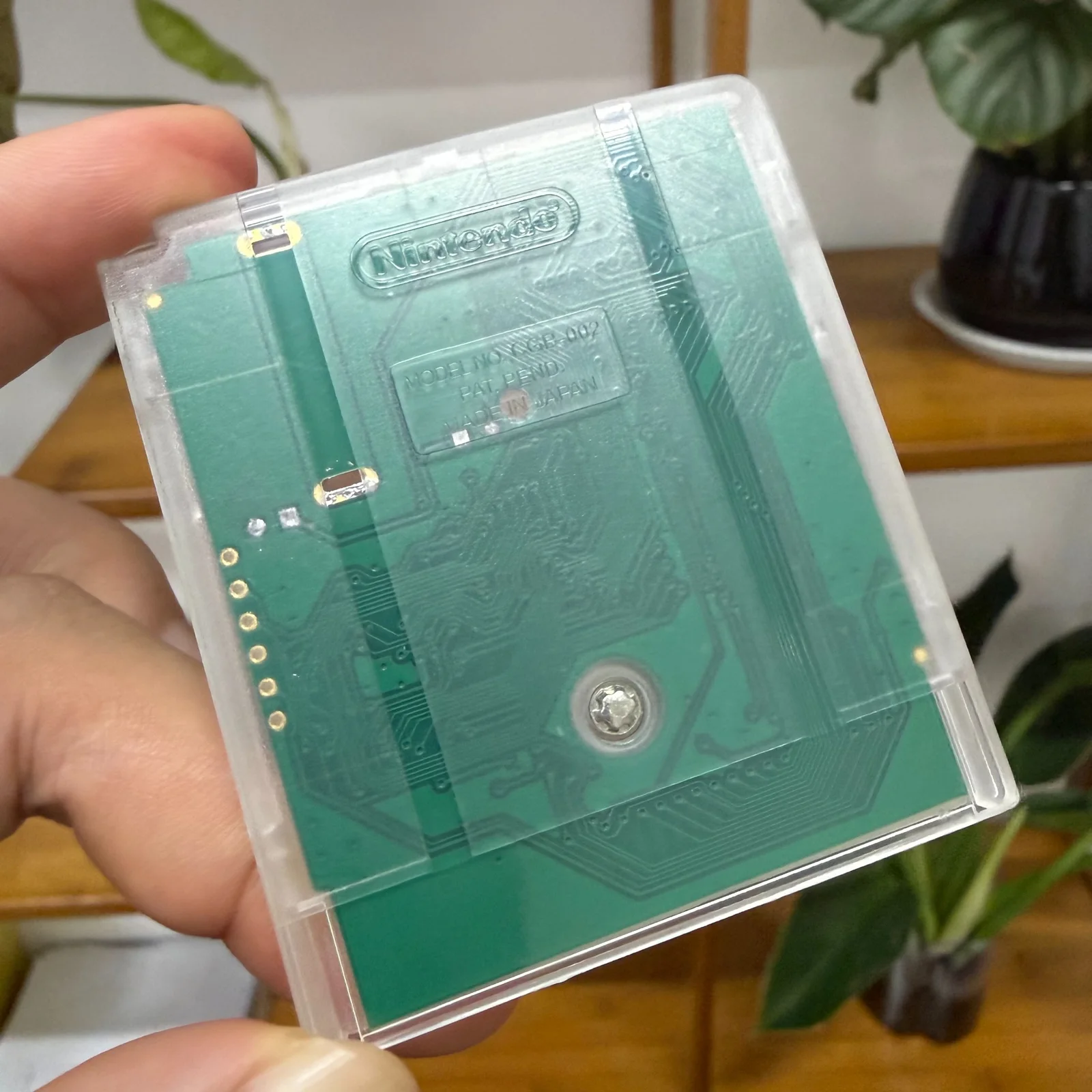 Original supplied cartridge sample: transparent rear shell showing PCB