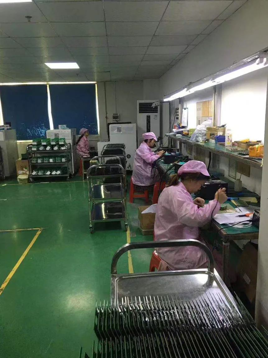 Actual operators at an electronics workbench